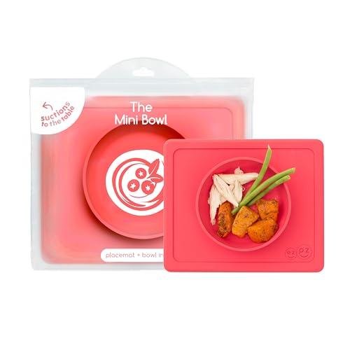 ezpz Mini Bowl (Coral) - 100% Silicone Suction Bowl with Built-in Placemat for Infants + Toddlers - Comes with a Reusable Travel Bag