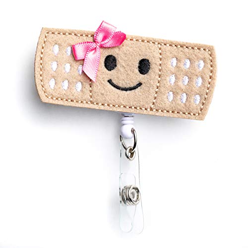 Nurseology Nurse Badge Reel Retractable – Nursing Name Badge Holder – Felt Badge Reel for Nurses, Students & Teachers – Cute Badge Reels for Nurses – Alligator Clip (Girl Bandaid) - Click to Buy